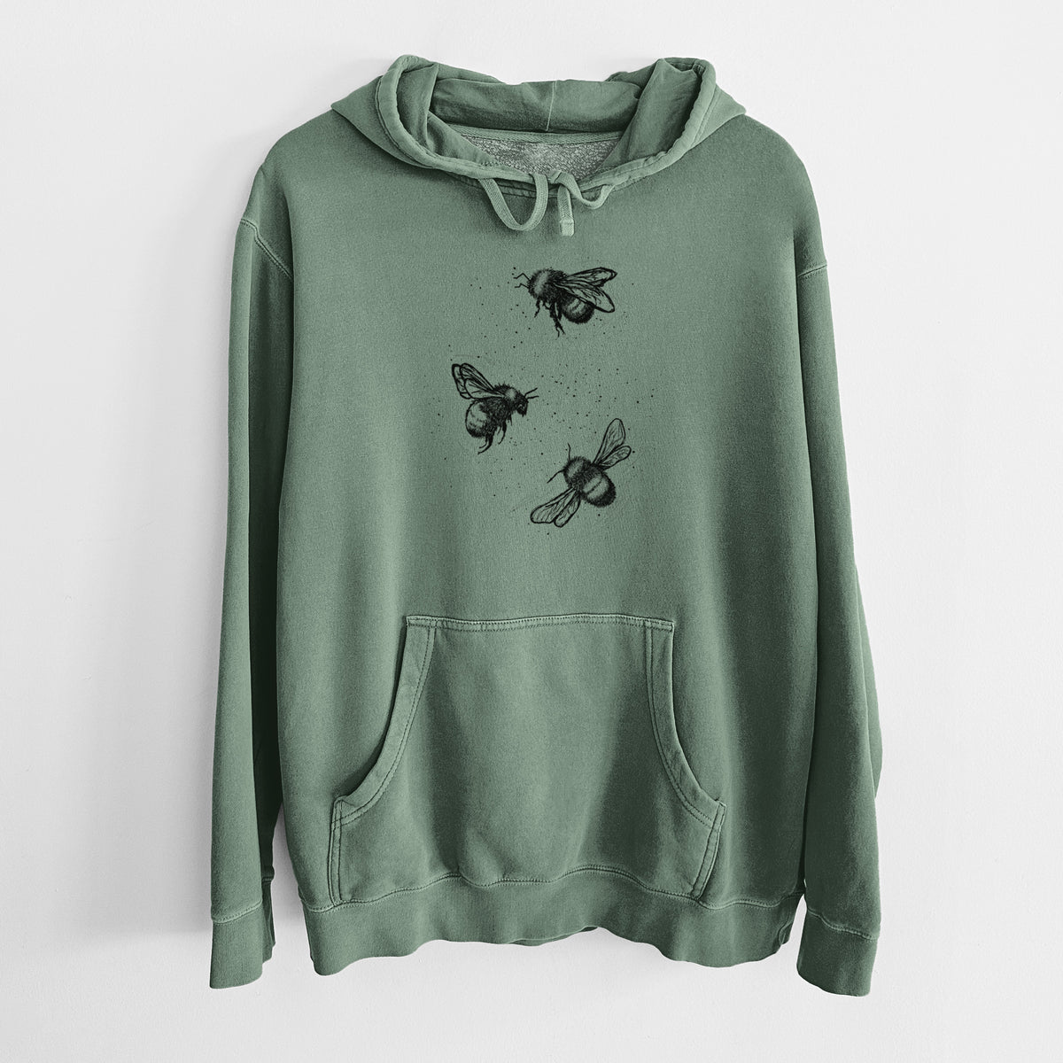 Alpine green pigment dyed hoodie laid flat, printed with a black ink illustration of three bumble bees flying.