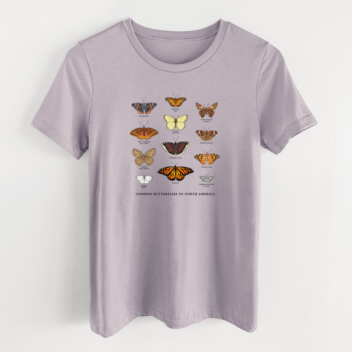 Light violet women's relaxed fit cotton t-shirt laid flat, printed with a full-color chart of common butterflies of North America, each labeled with its species.