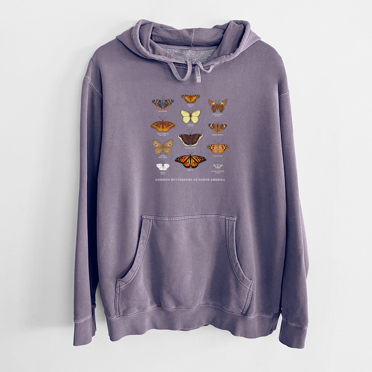 Plum purple pigment dyed hoodie laid flat, printed with a full-color chart of common butterflies of North America, each labeled with its species.
