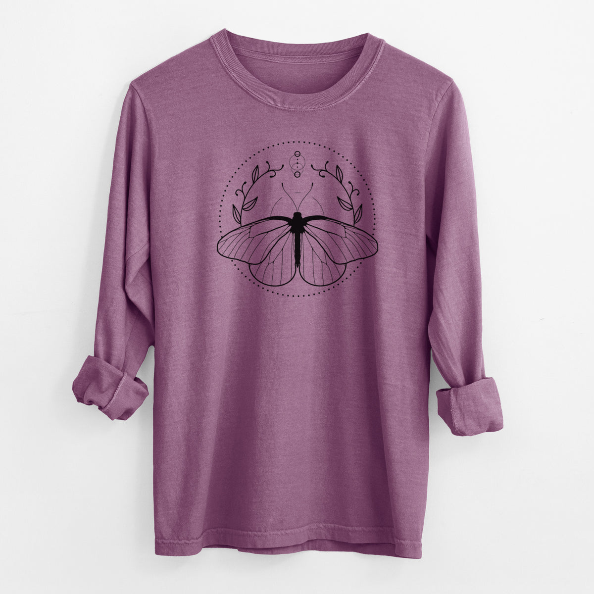 Berry pink Comfort Colors long sleeve shirt laid flat with the cuffs rolled, printed with a black ink butterfly inside a circle, framed by moon phases and leaves.