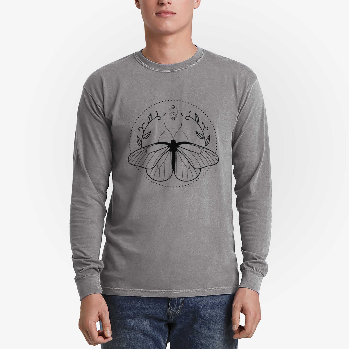 Man wearing a grey Comfort Colors long sleeve shirt printed with a black ink butterfly inside a circle, framed by moon phases and leaves.