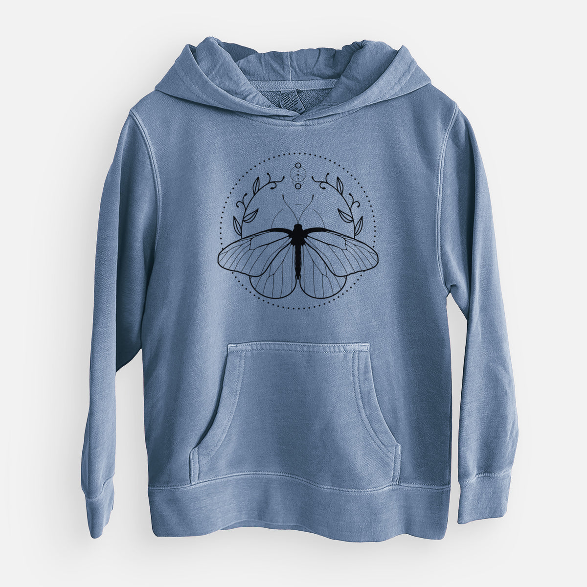 Slate blue youth pigment dyed hoodie laid flat, printed with a black ink butterfly inside a circle, framed by moon phases and leaves.