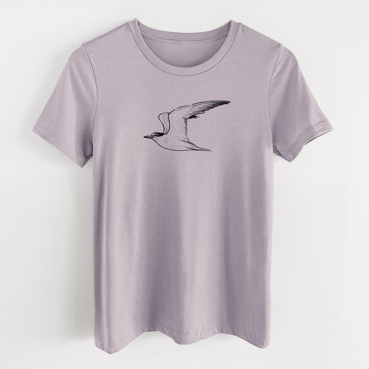 Light violet women's relaxed fit cotton t-shirt laid flat, printed with a black ink illustration of a California least tern in flight.