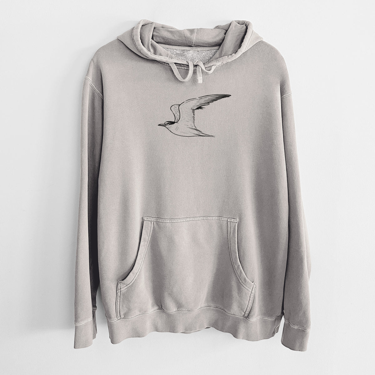 Cement grey pigment dyed hoodie laid flat, printed with a black ink illustration of a California least tern in flight.