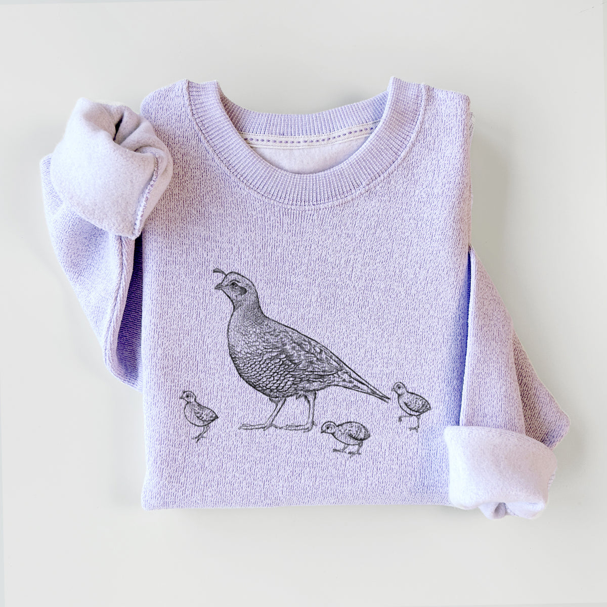 Ice purple knit sweatshirt printed with a black ink illustration of a California quail with its chicks, styled flat.