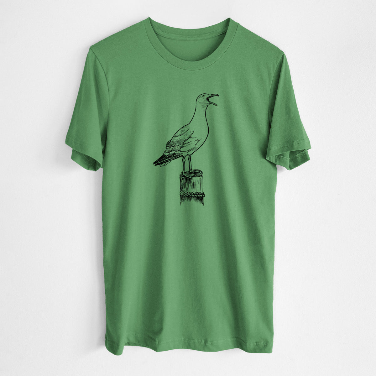 Leaf green lightweight cotton t-shirt laid flat, printed with a black ink illustration of a California gull calling from a wooden post.