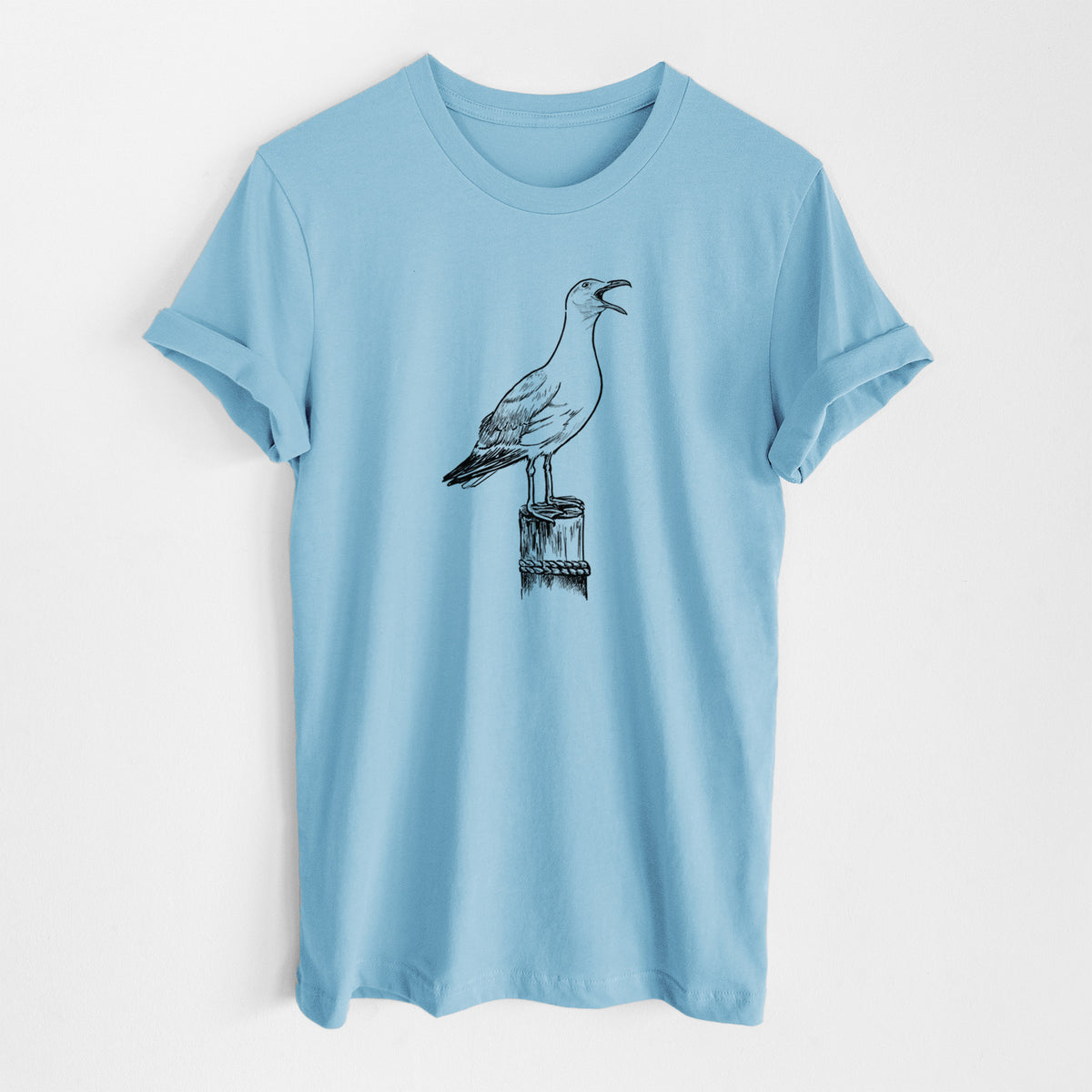 Ocean blue lightweight cotton t-shirt laid flat, printed with a black ink illustration of a California gull calling from a wooden post.
