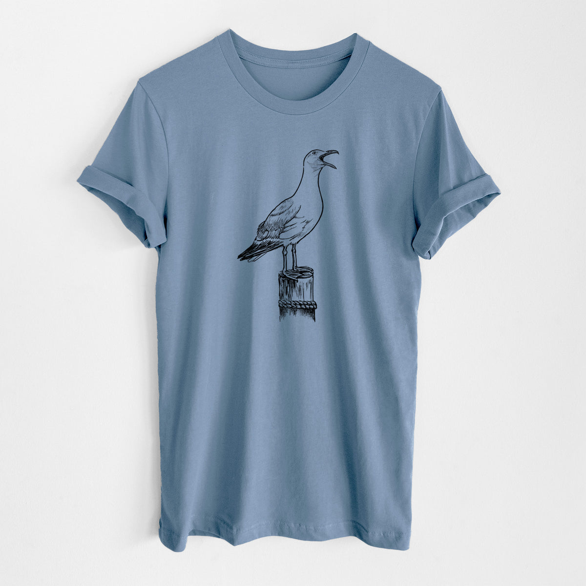 Steel blue lightweight cotton t-shirt laid flat, printed with a black ink illustration of a California gull calling from a wooden post.