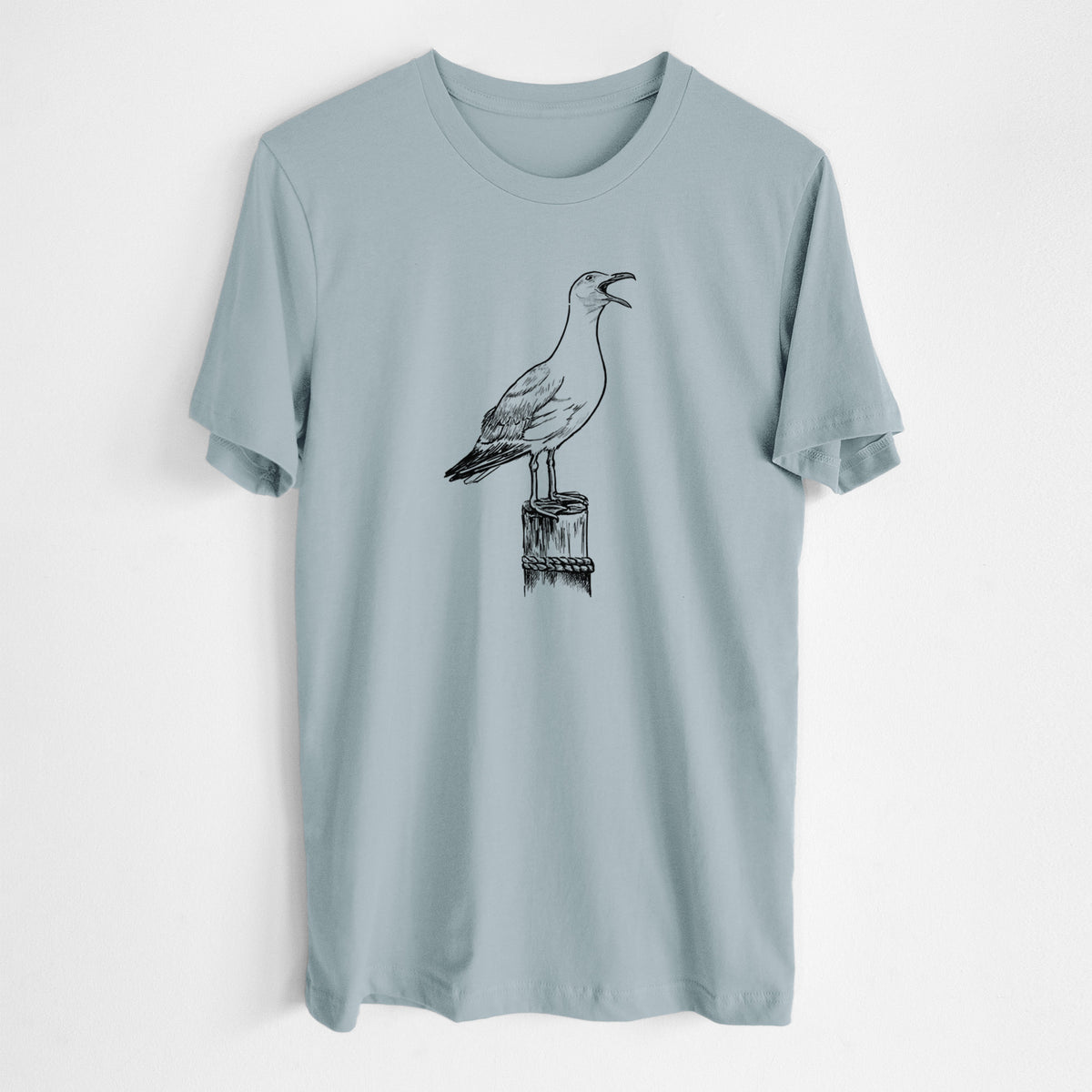 Vintage denim lightweight cotton t-shirt laid flat, printed with a black ink illustration of a California gull calling from a wooden post.