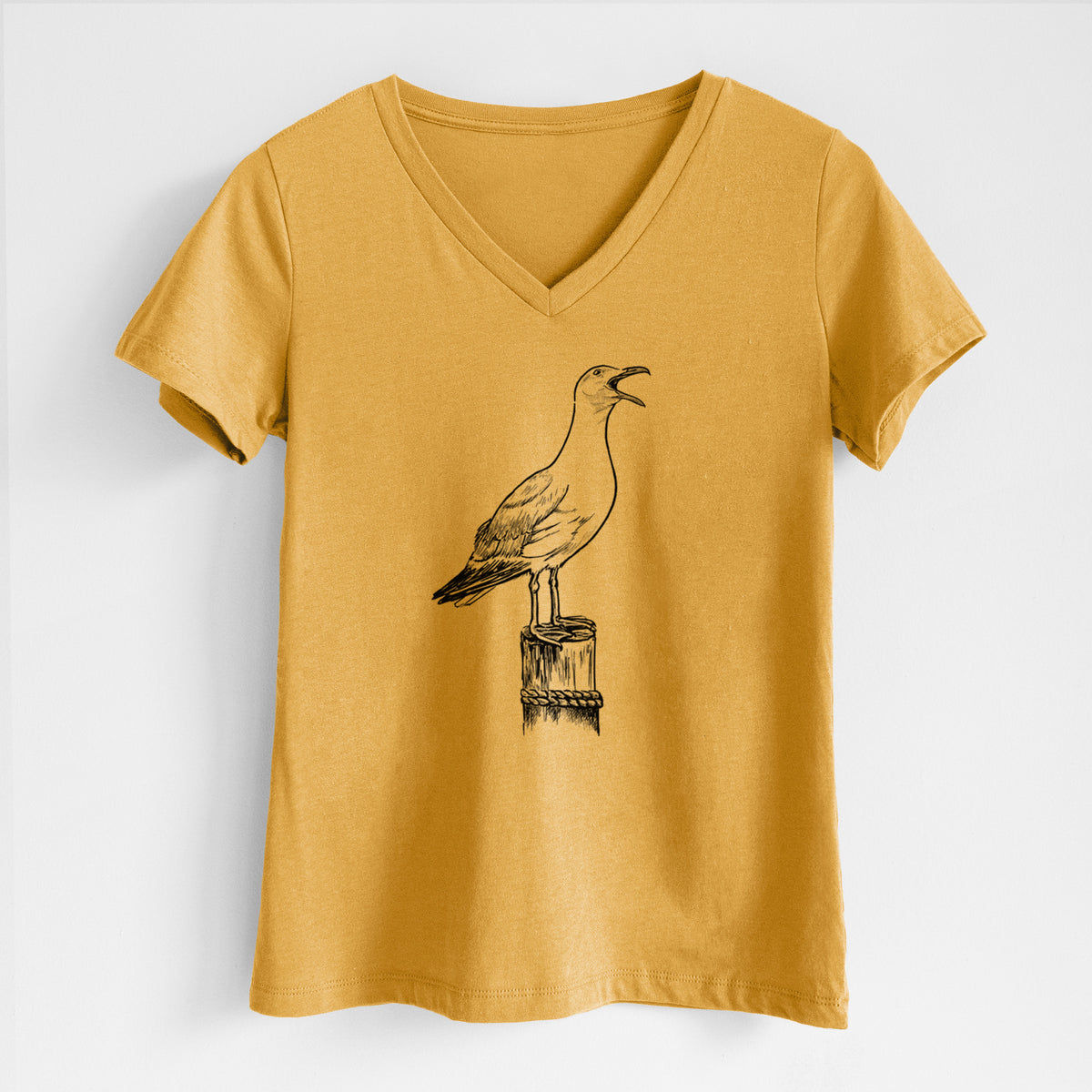Honeycomb yellow women's relaxed fit cotton V-neck t-shirt laid flat, printed with a black ink illustration of a California gull calling from a wooden post.
