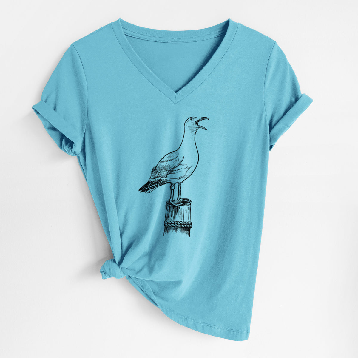 Turquoise women's relaxed fit cotton V-neck t-shirt laid flat, printed with a black ink illustration of a California gull calling from a wooden post.