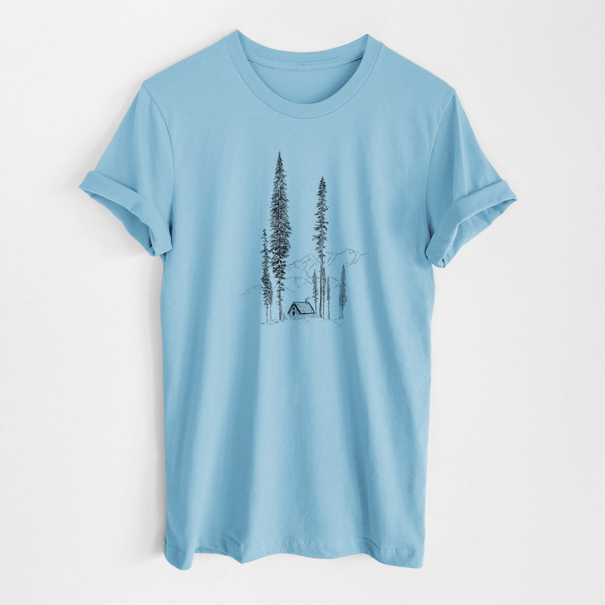 Ocean blue lightweight cotton t-shirt laid flat, printed with a black ink illustration of a small cabin nestled beneath towering pine trees.