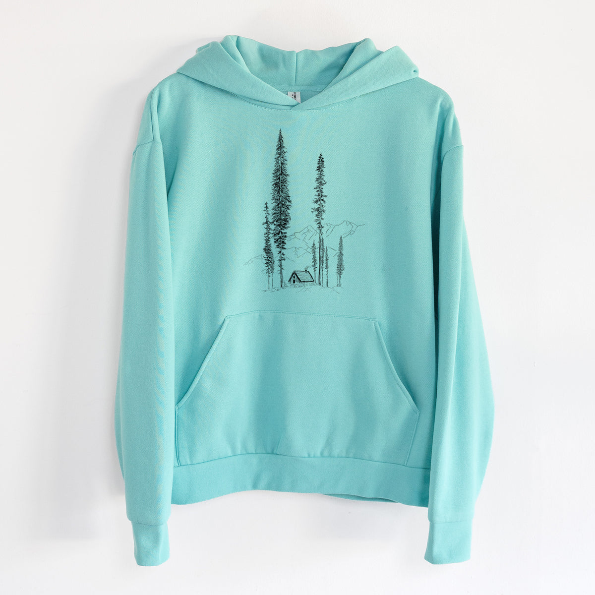 Mountain Pine Cabin Retreat - Statement Midweight Hoodie in Seafoam, hanging on a white wall, with a front kangaroo pocket and no drawcords.