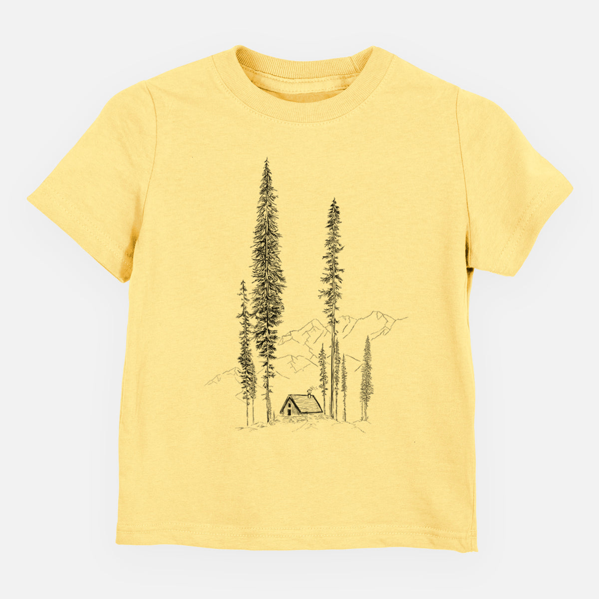 Butter yellow toddler t-shirt laid flat, printed with a black ink illustration of a small cabin nestled beneath towering pine trees.