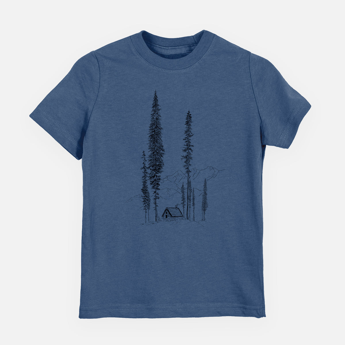 Indigo blue youth t-shirt laid flat, printed with a black ink illustration of a small cabin nestled beneath towering pine trees.
