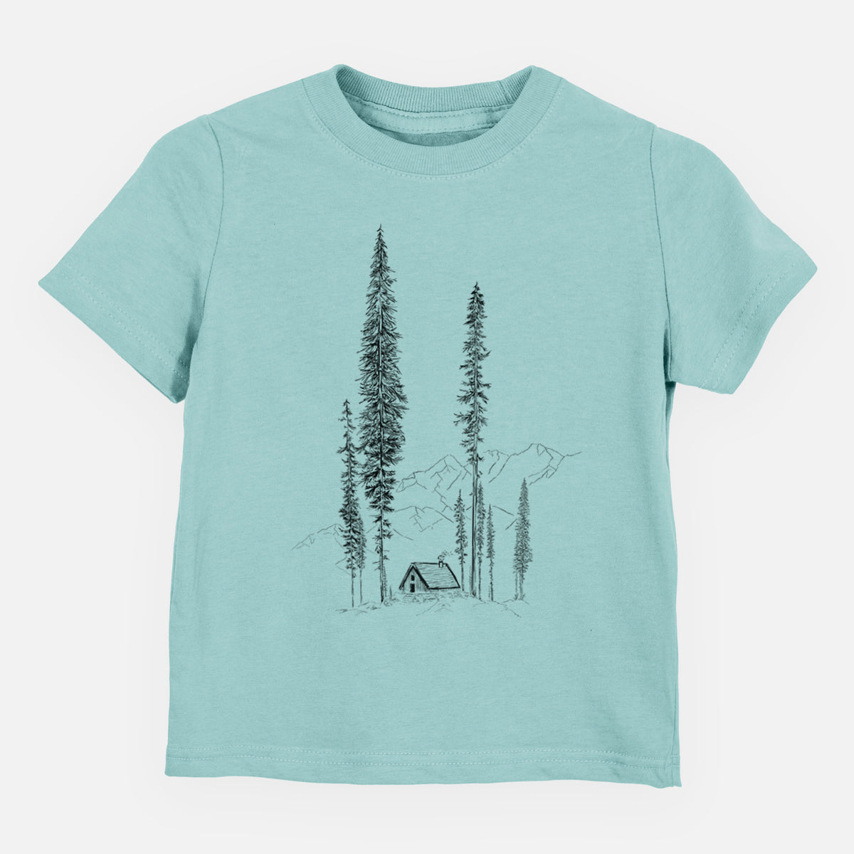 Saltwater toddler t-shirt laid flat, printed with a black ink illustration of a small cabin nestled beneath towering pine trees.