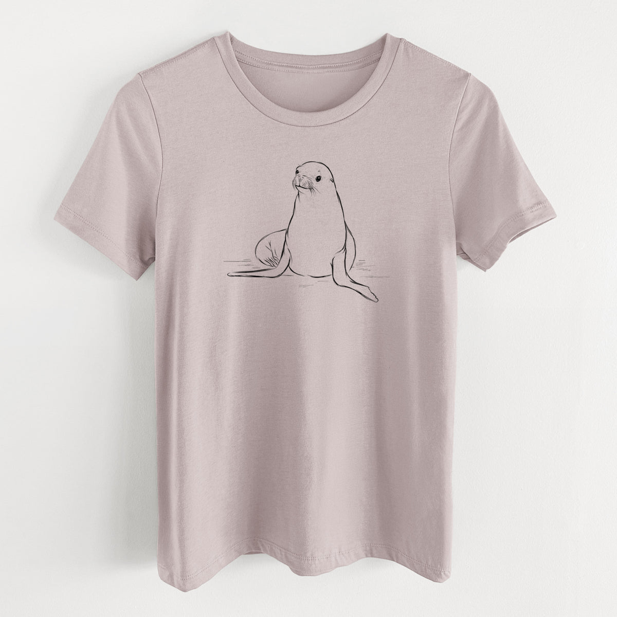 Pink gravel women's relaxed fit cotton t-shirt laid flat, printed with a black ink illustration of a California sea lion sitting upright.