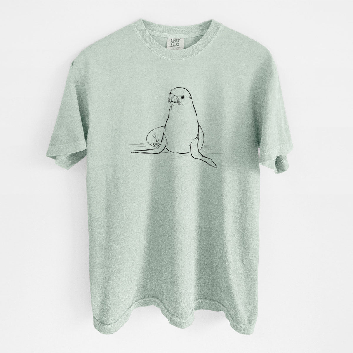 Bay green Comfort Colors t-shirt laid flat, printed with a black ink illustration of a California sea lion sitting upright.