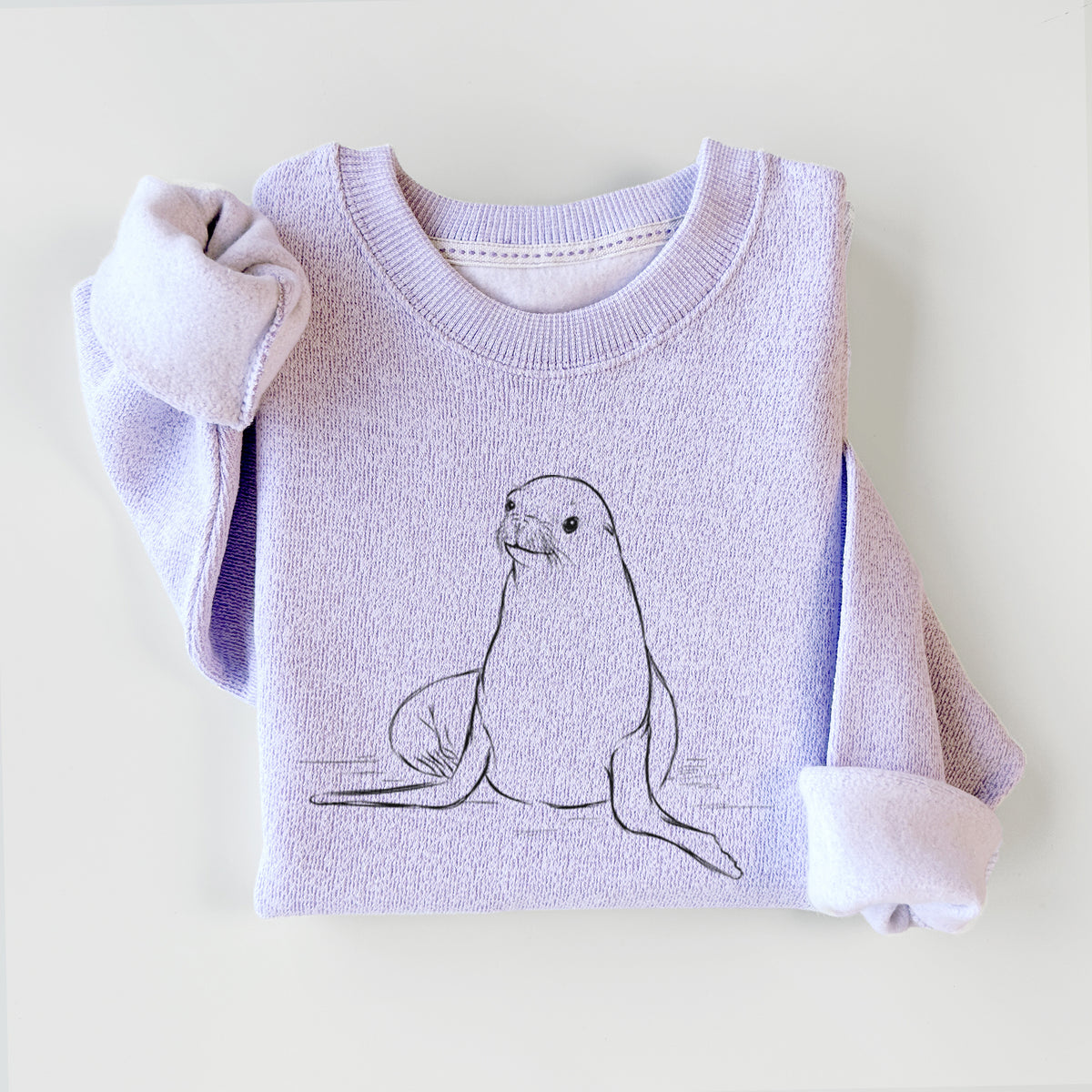 Ice purple knit sweatshirt printed with a black ink illustration of a California sea lion sitting upright, styled flat.