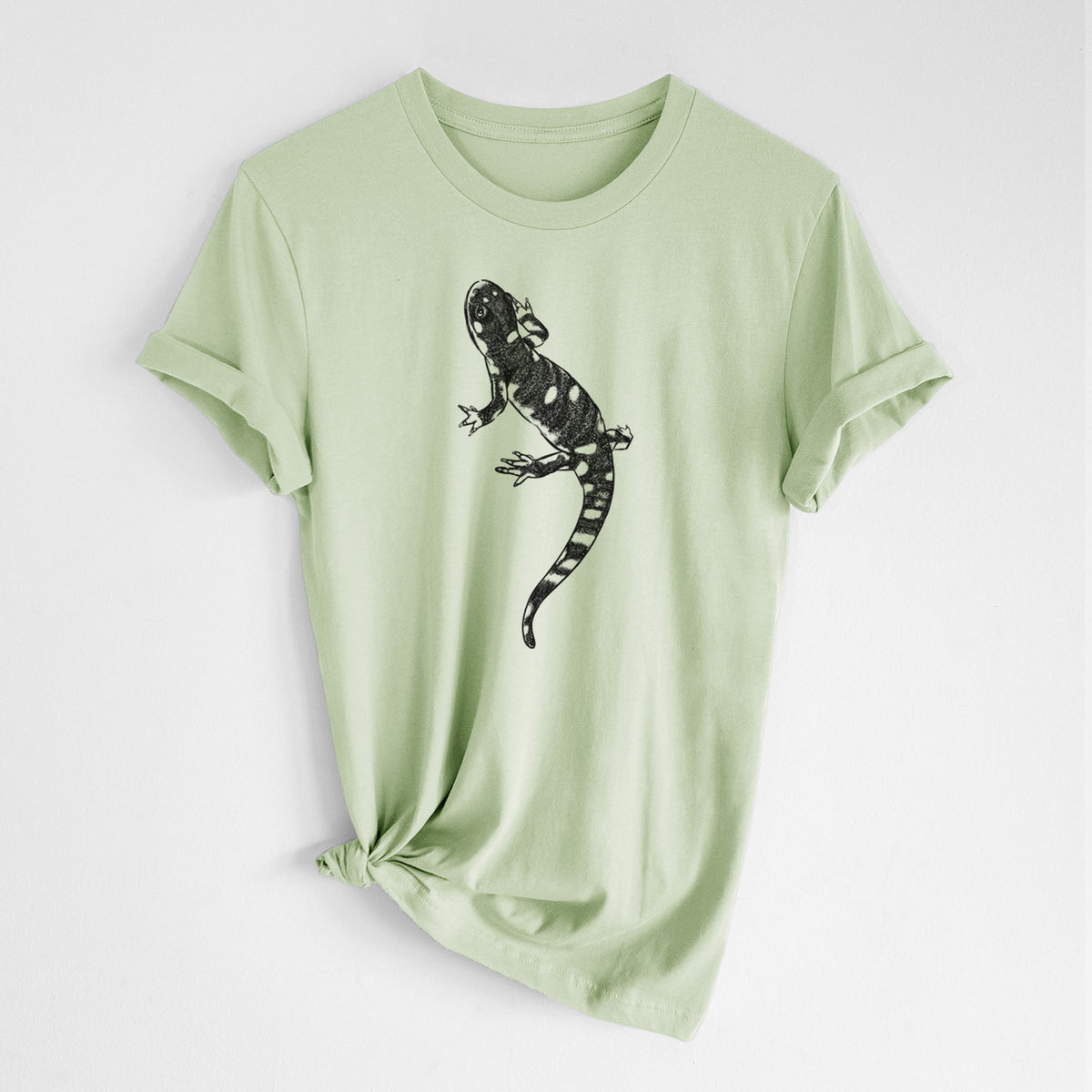 Spring green lightweight cotton t-shirt laid flat with the sleeves rolled, printed with a detailed black ink illustration of a spotted California tiger salamander.