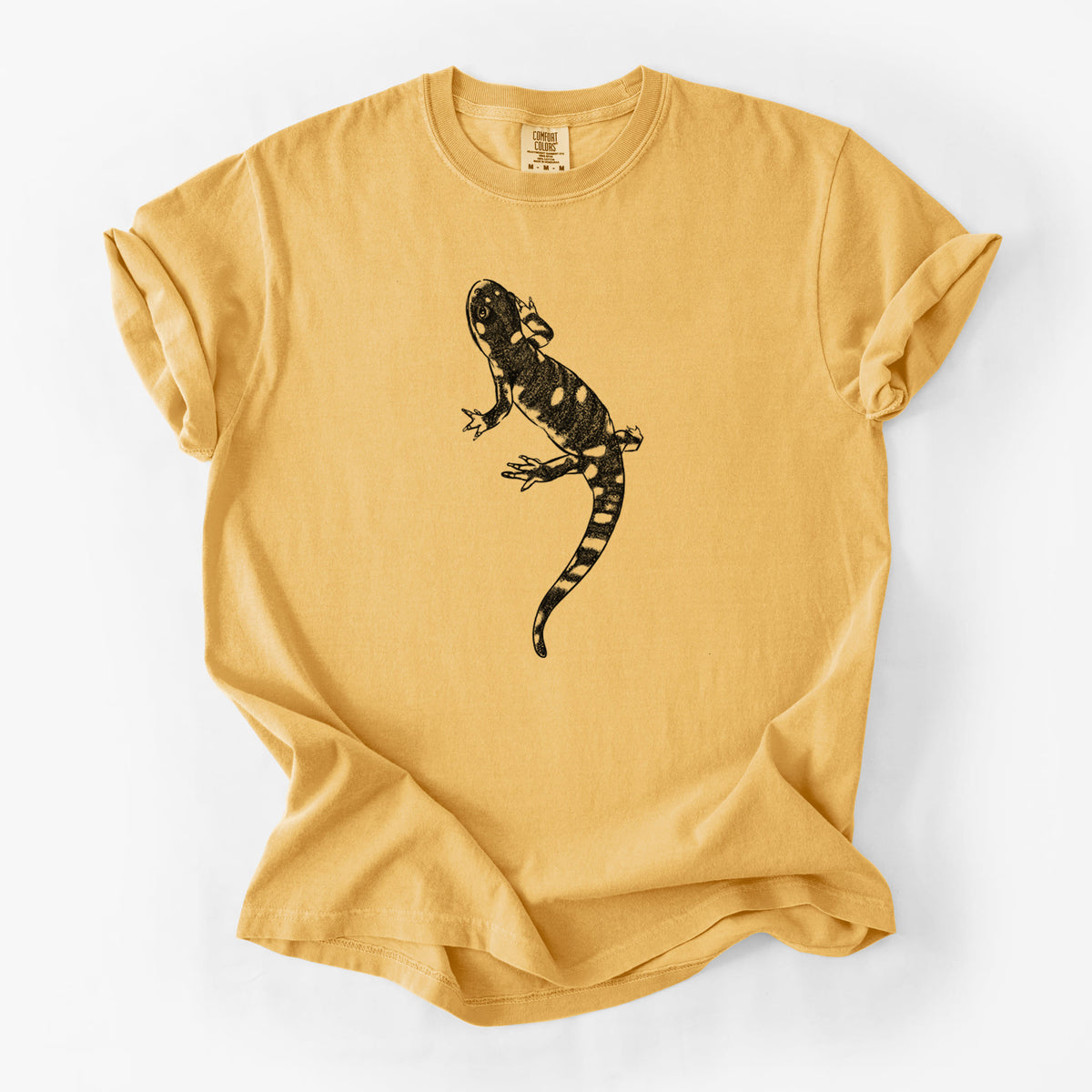 Golden wheat yellow Comfort Colors t-shirt laid flat, printed with a detailed black ink illustration of a spotted California tiger salamander.