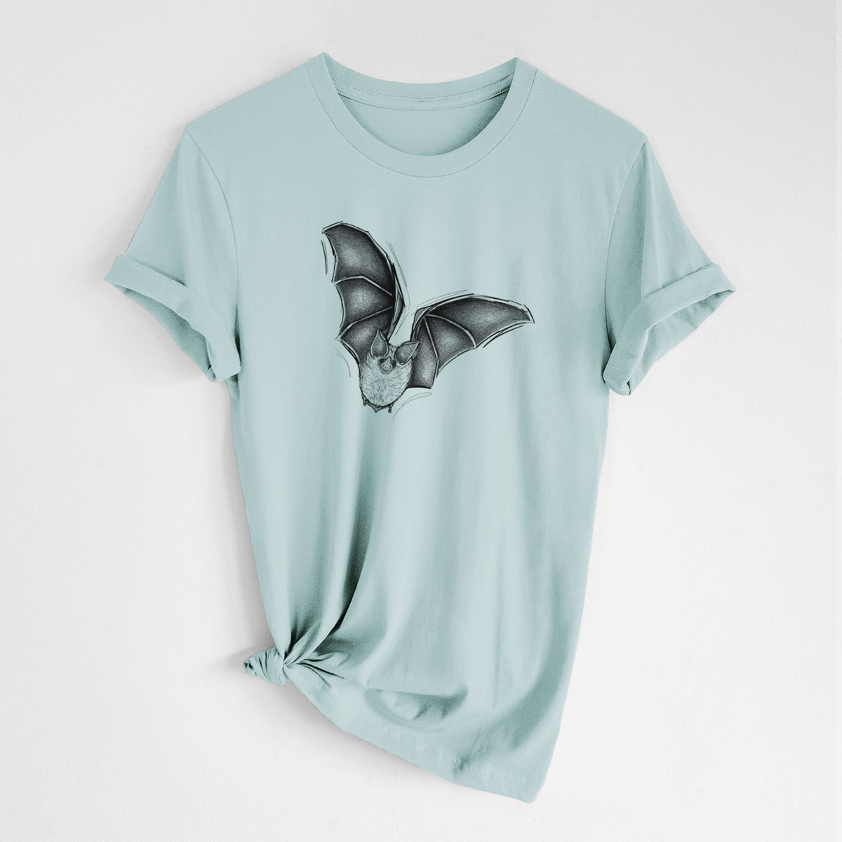Dusty blue lightweight cotton t-shirt laid flat with the sleeves rolled, printed with a detailed black ink illustration of a California leaf-nosed bat in flight.