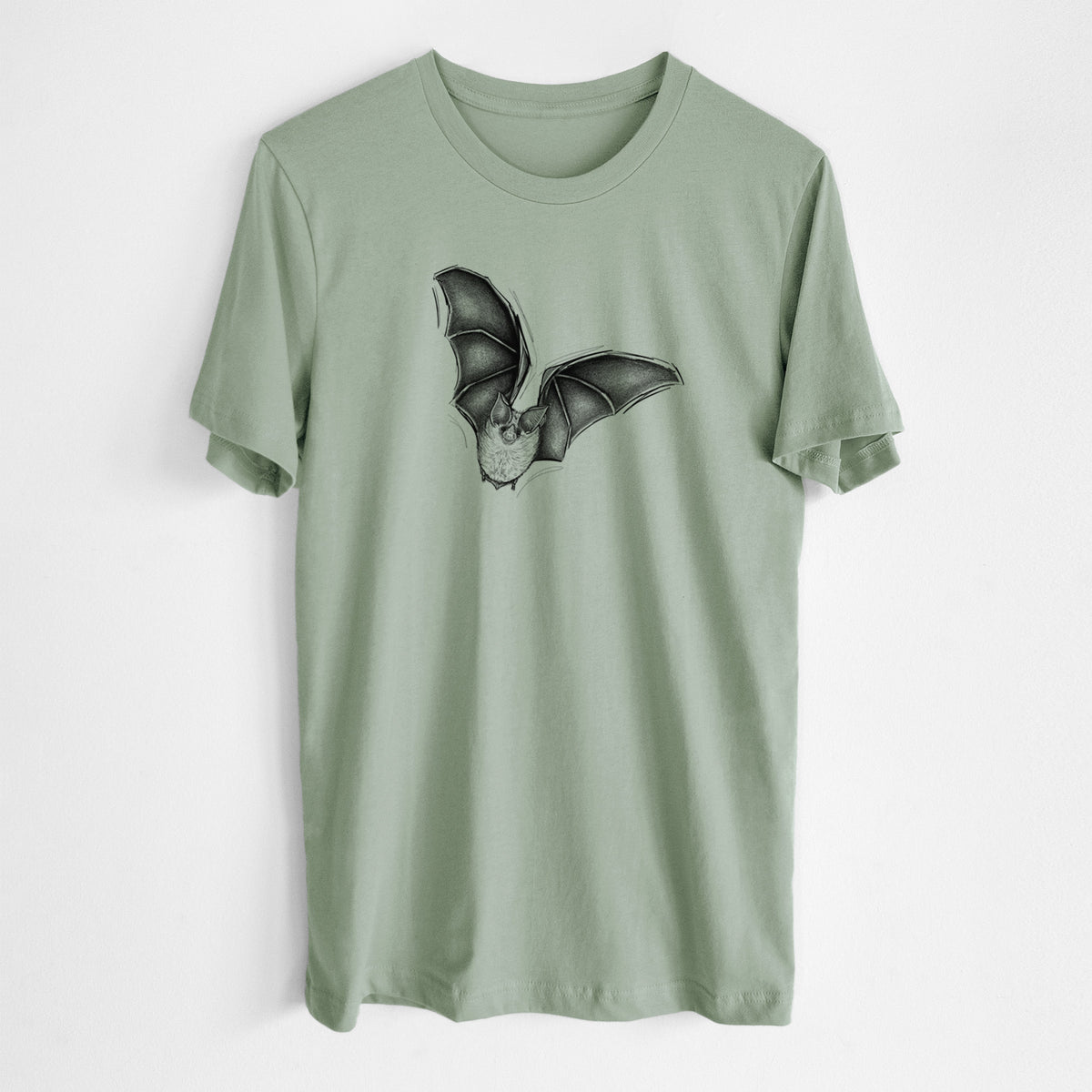 Sage green lightweight cotton t-shirt laid flat, printed with a detailed black ink illustration of a California leaf-nosed bat in flight.
