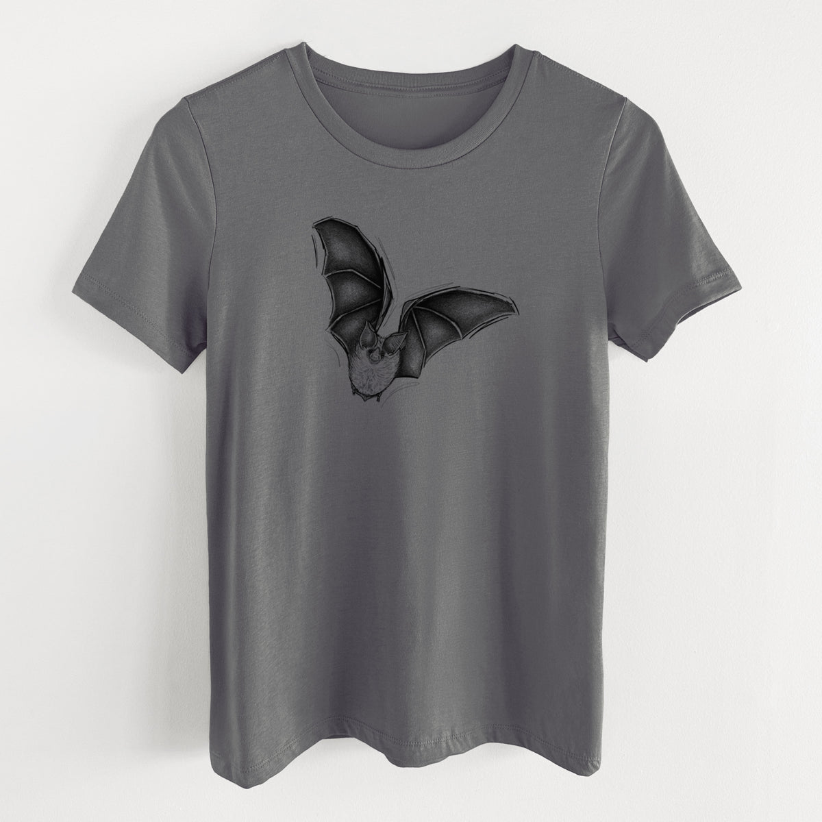 Asphalt women's relaxed fit cotton t-shirt laid flat, printed with a detailed black ink illustration of a California leaf-nosed bat in flight.