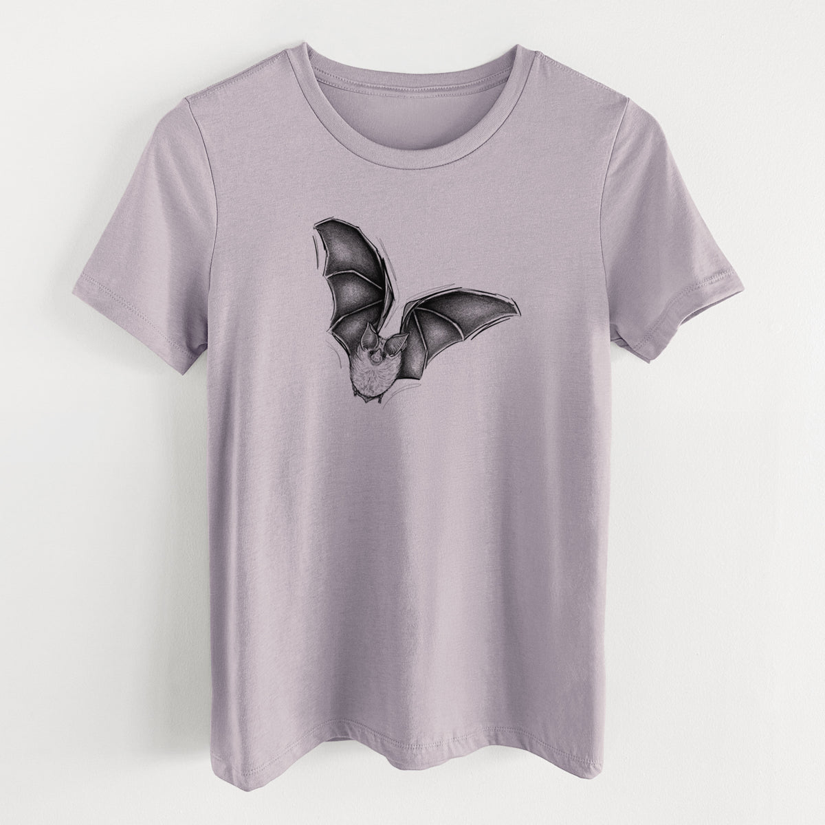 Light violet women's relaxed fit cotton t-shirt laid flat, printed with a detailed black ink illustration of a California leaf-nosed bat in flight.