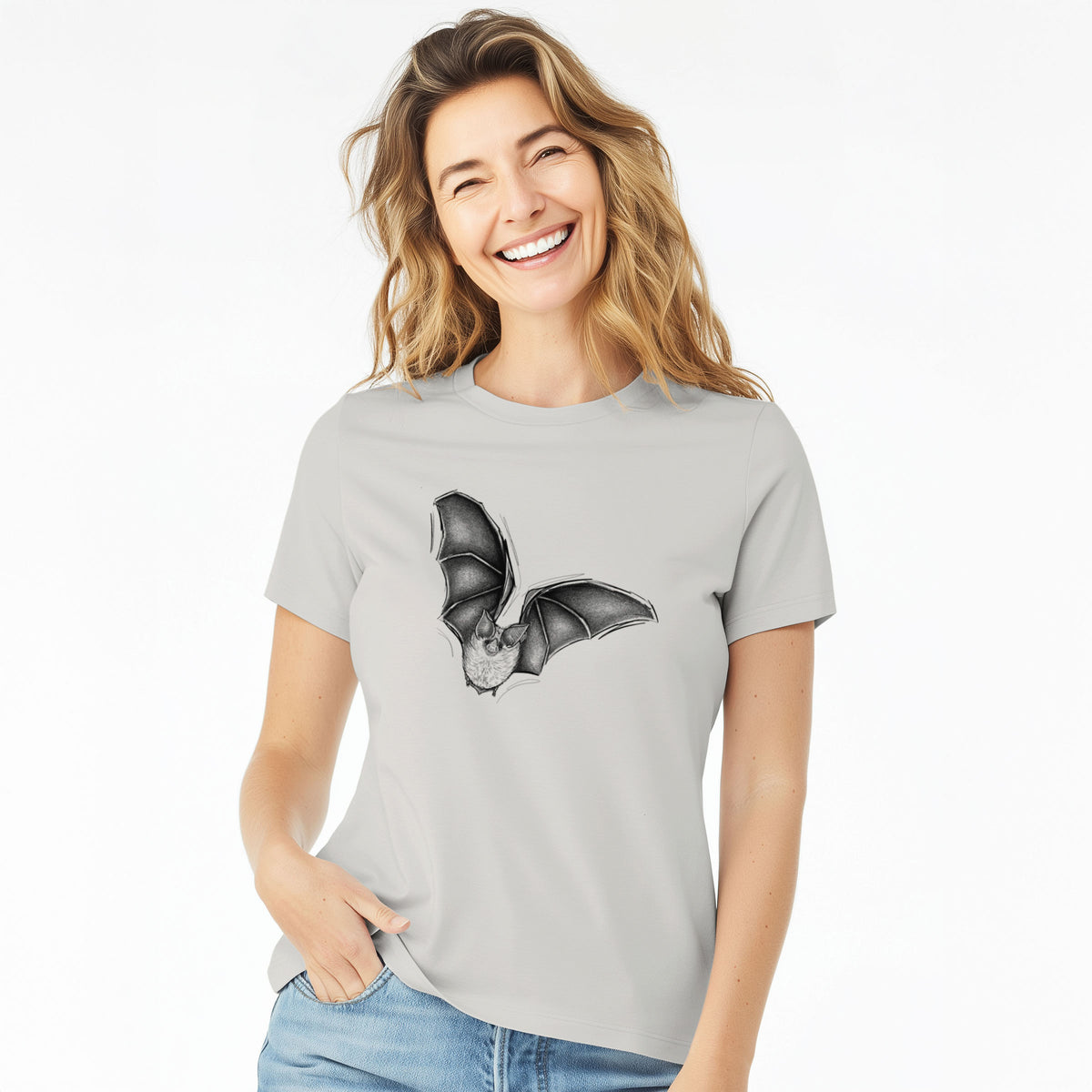 Woman wearing a lunar grey women's relaxed fit cotton t-shirt printed with a detailed black ink illustration of a California leaf-nosed bat in flight.