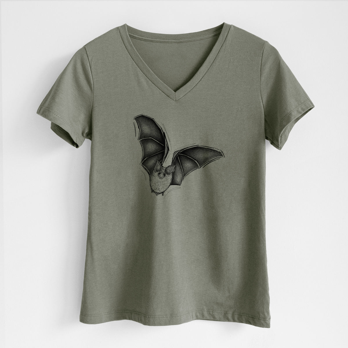 Military green women's relaxed fit cotton V-neck t-shirt laid flat, printed with a detailed black ink illustration of a California leaf-nosed bat in flight.