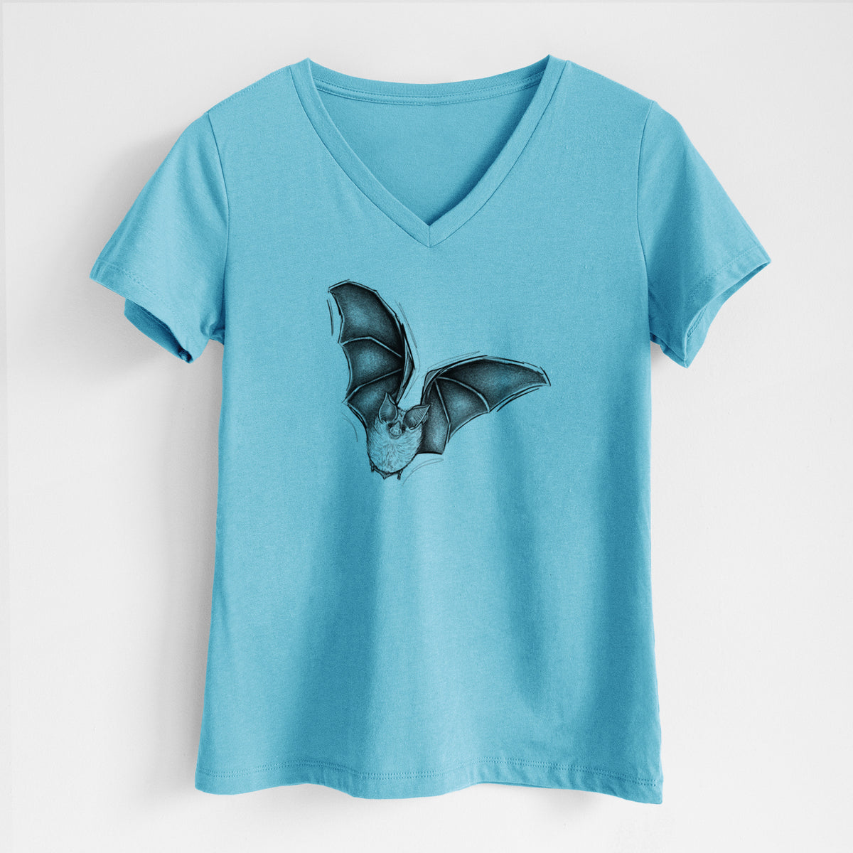 Turquoise women's relaxed fit cotton V-neck t-shirt laid flat, printed with a detailed black ink illustration of a California leaf-nosed bat in flight.