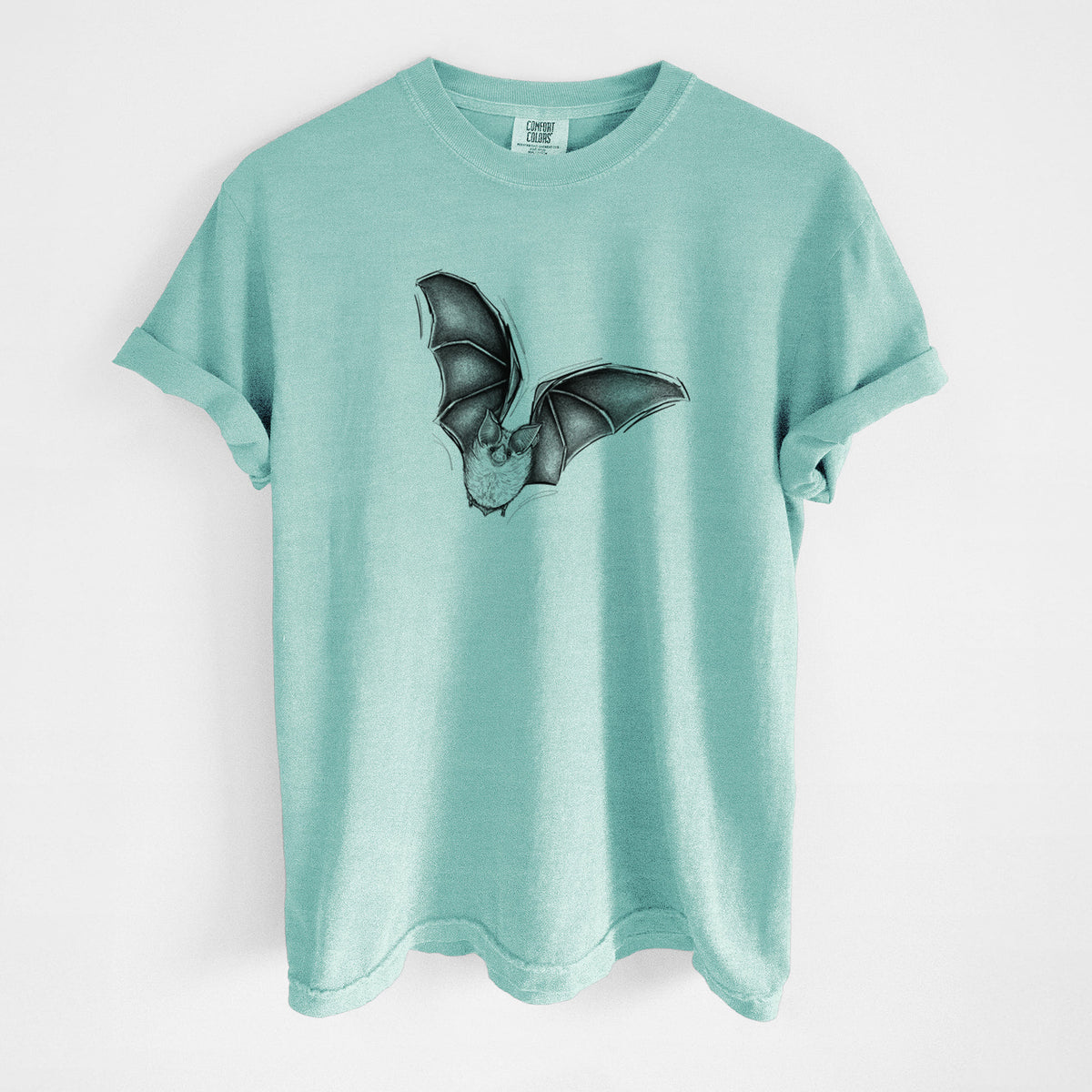 Chalky mint Comfort Colors t-shirt laid flat, printed with a detailed black ink illustration of a California leaf-nosed bat in flight.