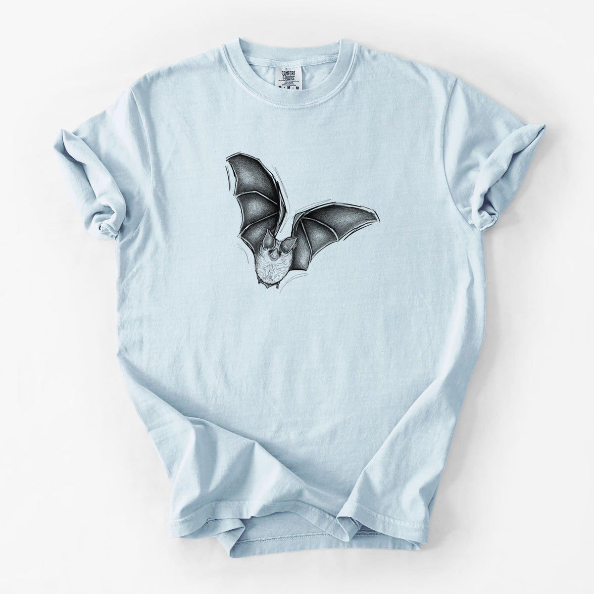 Chambray blue Comfort Colors t-shirt laid flat, printed with a detailed black ink illustration of a California leaf-nosed bat in flight.