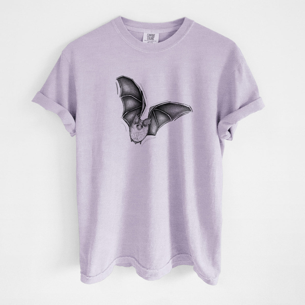 Orchid purple Comfort Colors t-shirt laid flat, printed with a detailed black ink illustration of a California leaf-nosed bat in flight.