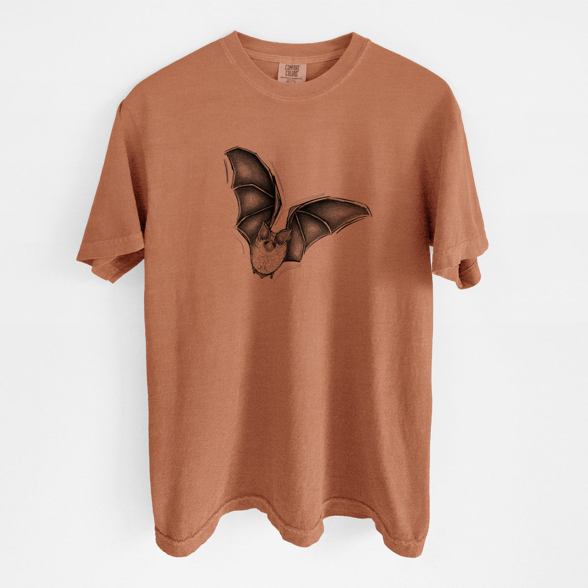 Yam burnt orange Comfort Colors t-shirt laid flat, printed with a detailed black ink illustration of a California leaf-nosed bat in flight.