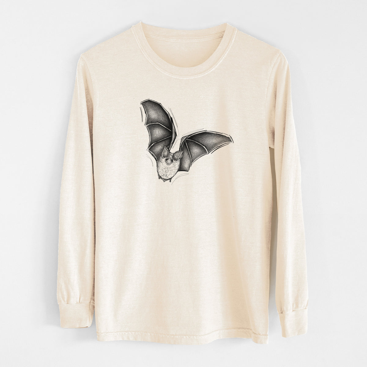 Ivory Comfort Colors long sleeve shirt laid flat, printed with a detailed black ink illustration of a California leaf-nosed bat in flight.