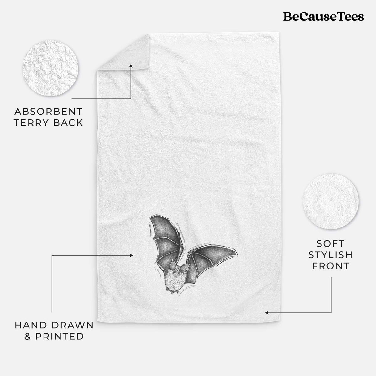 White hand towel printed with a detailed black ink illustration of a California leaf-nosed bat in flight.