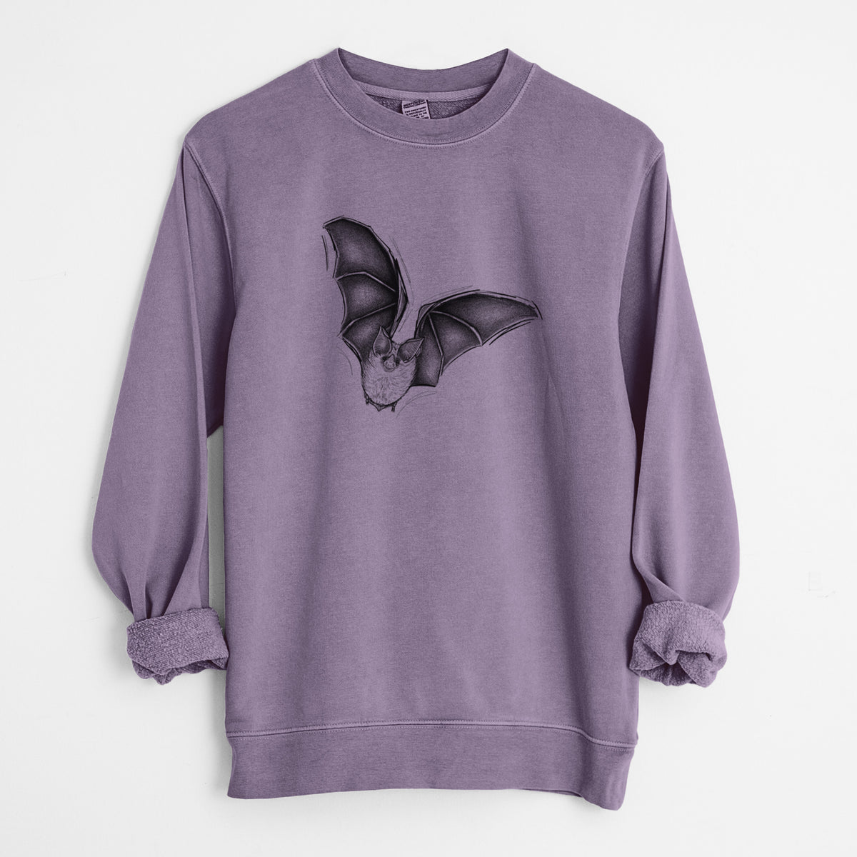 Plum purple pigment dyed crewneck sweatshirt laid flat with the sleeves rolled, printed with a detailed black ink illustration of a California leaf-nosed bat in flight.