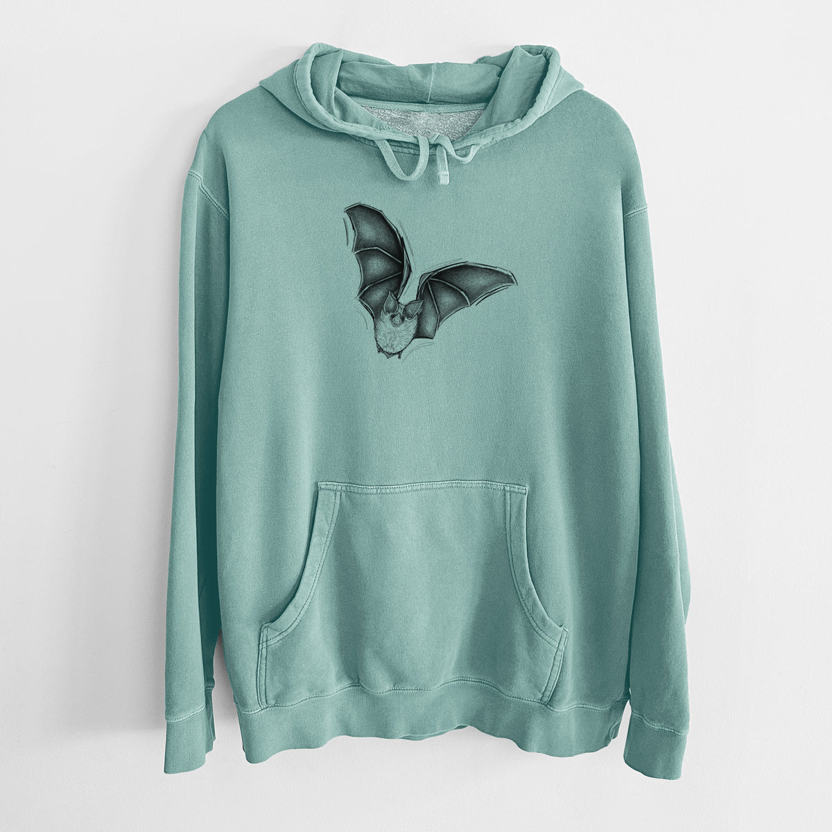 Mint green pigment dyed hoodie laid flat, printed with a detailed black ink illustration of a California leaf-nosed bat in flight.