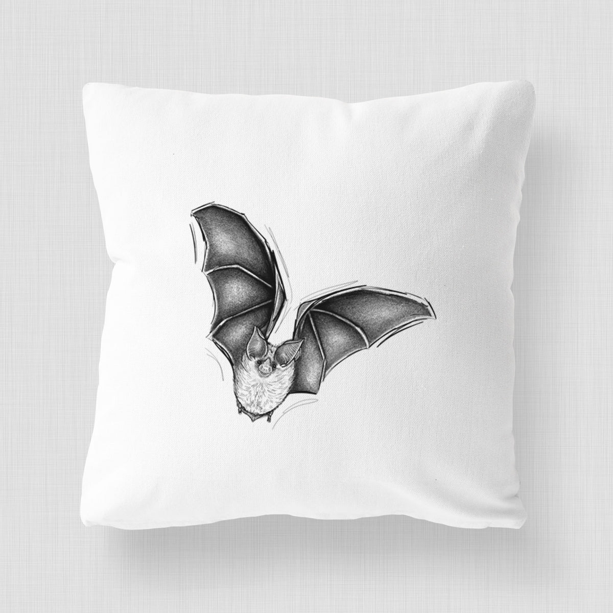 White pillow cover printed with a detailed black ink illustration of a California leaf-nosed bat in flight.