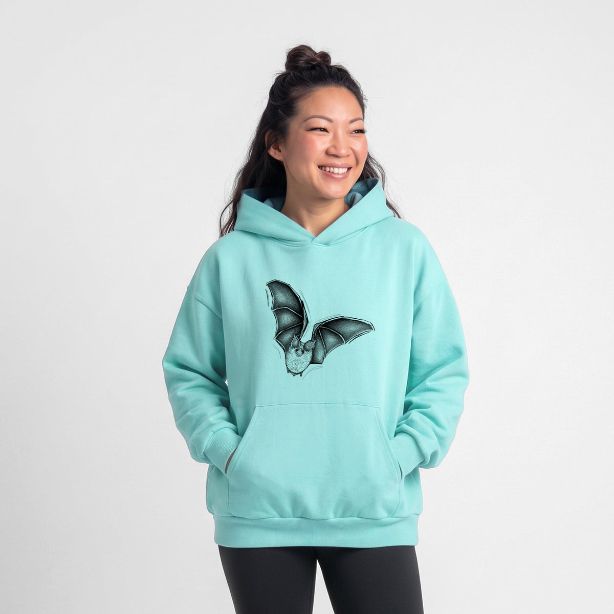 Female model wearing the Macrotus californicus - California Leaf-nosed Bat - Statement Midweight Hoodie.