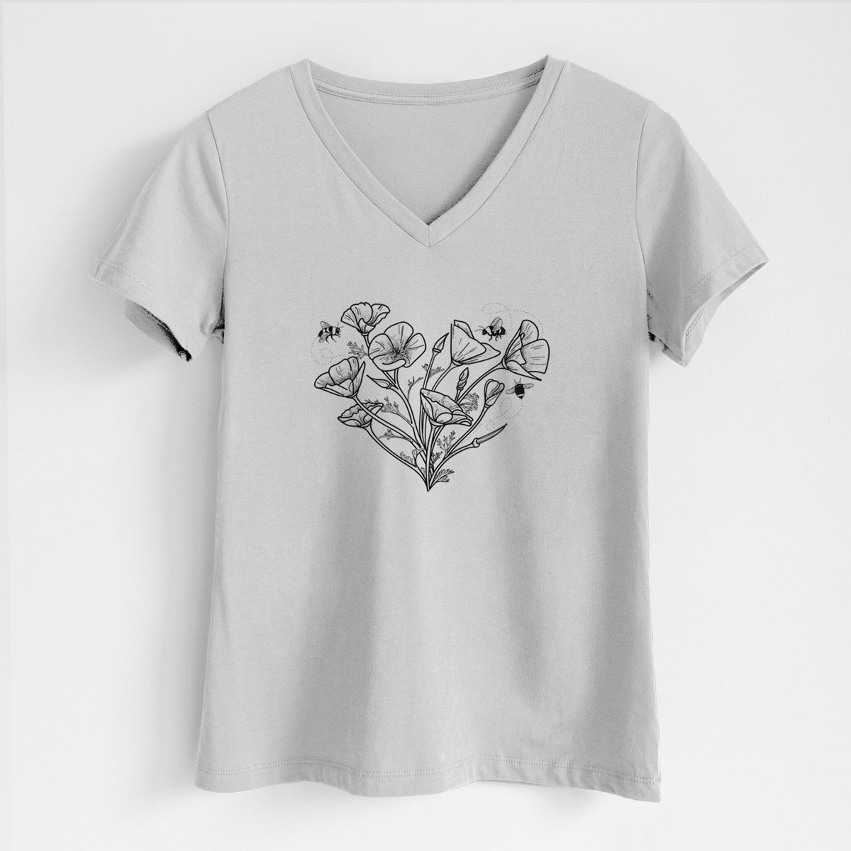 Lunar grey women's relaxed fit cotton V-neck t-shirt laid flat, printed with a black ink line drawing of California poppies arranged in a heart shape, with small bees.