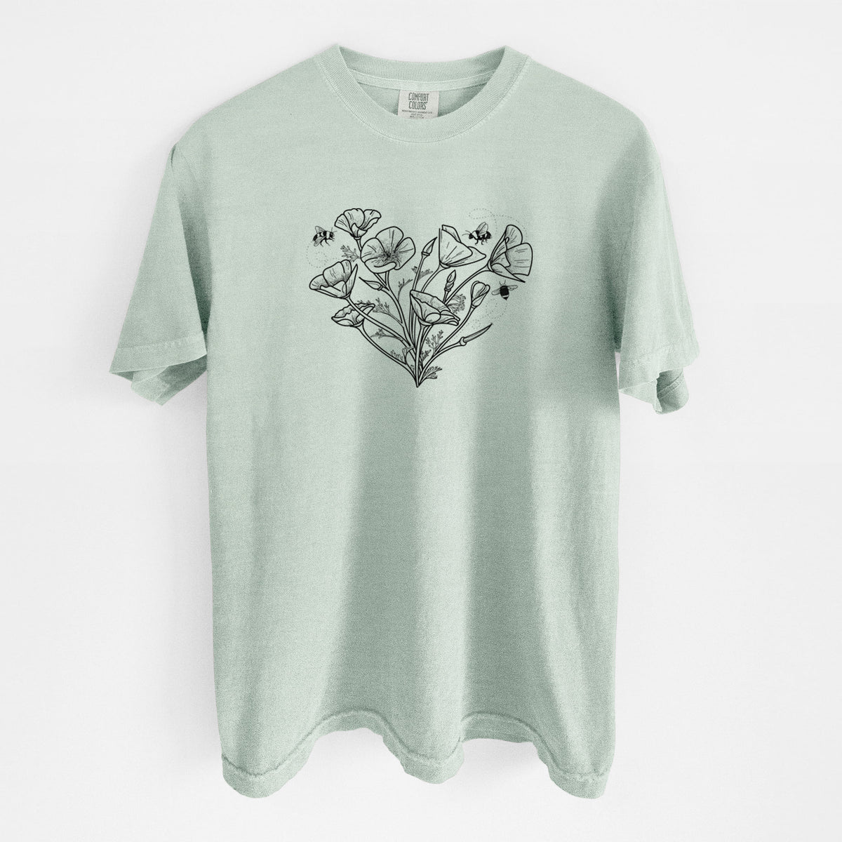 Bay green Comfort Colors t-shirt laid flat, printed with a black ink line drawing of California poppies arranged in a heart shape, with small bees.
