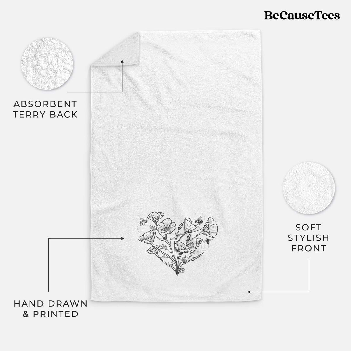 White hand towel printed with a black ink line drawing of California poppies arranged in a heart shape, with small bees.