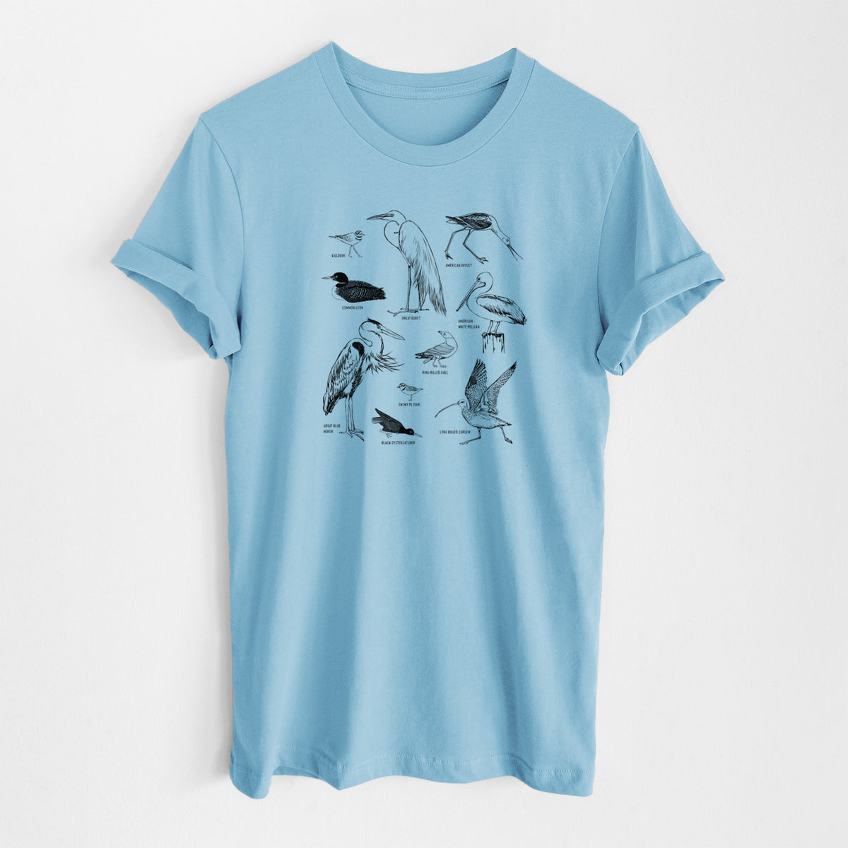Ocean blue lightweight cotton t-shirt laid flat, printed with a chart of black ink California shorebirds, including herons, egrets, avocets and sandpipers.