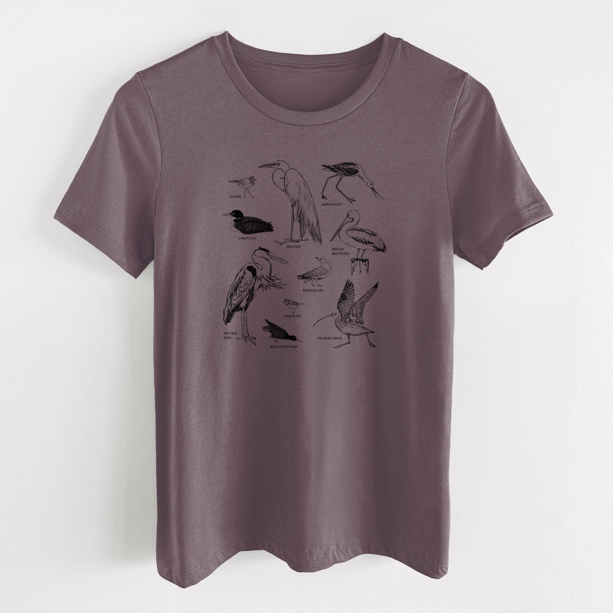 Purple storm women's relaxed fit cotton t-shirt laid flat, printed with a chart of black ink California shorebirds, including herons, egrets, avocets and sandpipers.