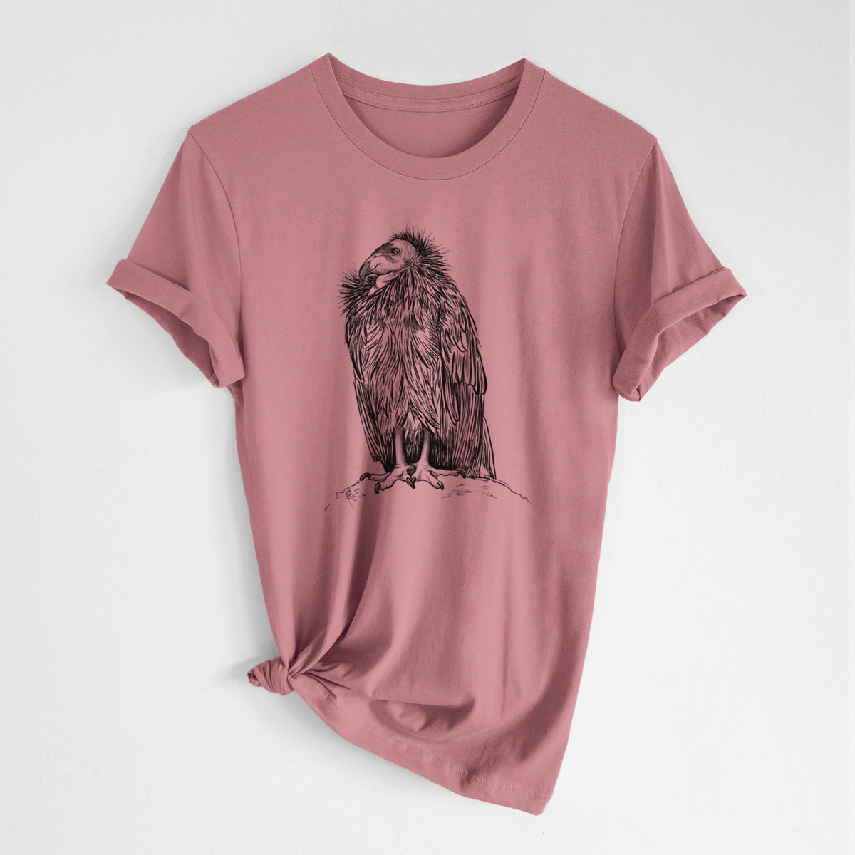 Mauve pink lightweight cotton t-shirt laid flat with the sleeves rolled, printed with a detailed black ink illustration of a California condor perched with folded wings.