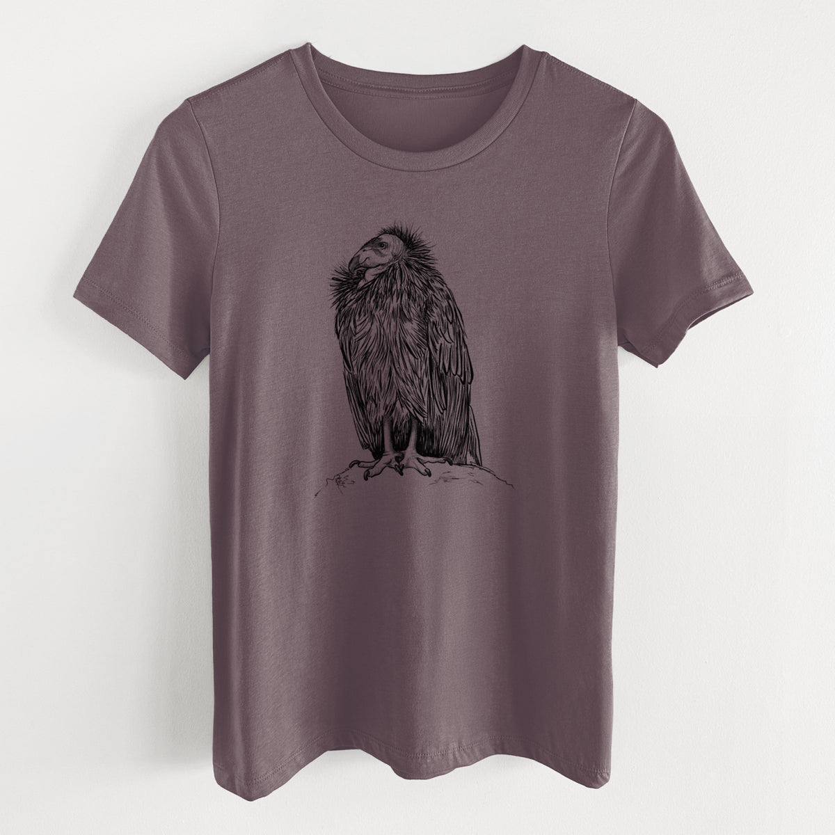 Purple storm women's relaxed fit cotton t-shirt laid flat, printed with a detailed black ink illustration of a California condor perched with folded wings.