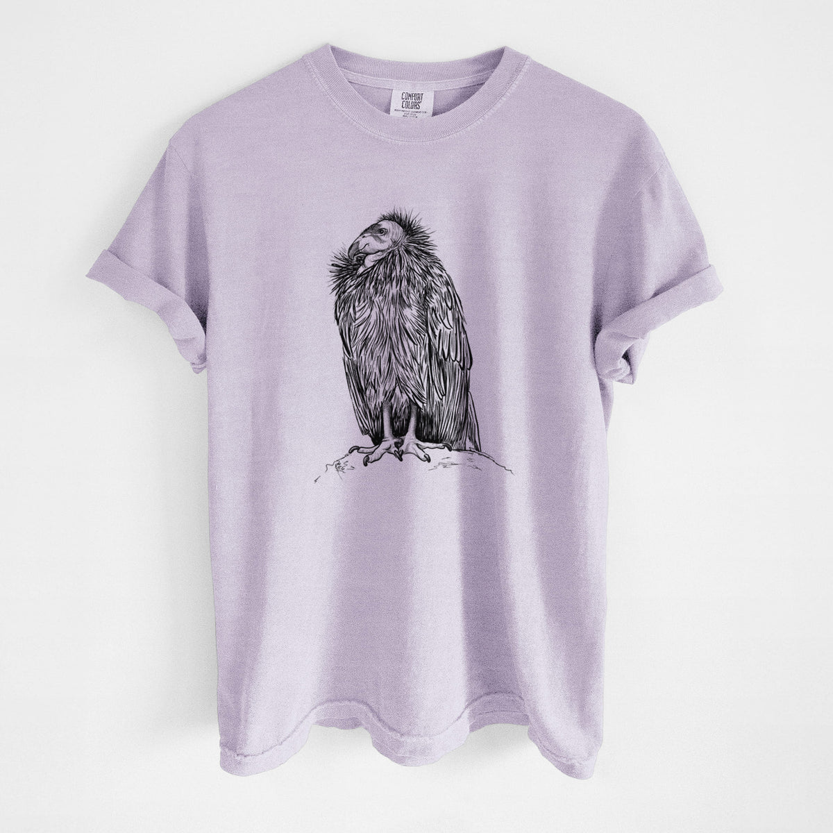 Orchid purple Comfort Colors t-shirt laid flat, printed with a detailed black ink illustration of a California condor perched with folded wings.